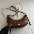 Retro coffee brown half-moon underarm bag with sleek gold metal accent and matte leather - Brown