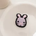 Close-up of handmade crochet rabbit hair clip showing detailed purple knit texture - Purple Rabbit
