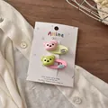 Detail of pink and green bear hair clips with handmade labels on display card - Pink Green Bear Duckbill Clip