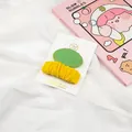 Detail of green oval and yellow pleated fabric hair clips for girls on a handmade card - Grass Green/Cream Yellow