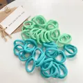 Detail of high-elastic seamless hair ties in mint green and lake blue candy colors - Green