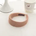 Detail of soft mohair knit headband in lotus root pink with a handmade woven label - Cocoa Coffee