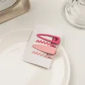 Detalle de set de 4 horquillas rosa mate incluyendo estilos ondulados y forma de gota - Serie Rosa