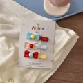 Three colorful Korean-style bow hair clips with vibrant contrast colors on white card - Bowknot Duckbill Clip