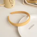 Close-up of light yellow twill fabric headband with soft sponge and non-slip lining - Corn Yellow