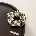 Close-up of olive green and cream checkered scrunchie on a rustic wooden tray - 2# Scrunchie - Green