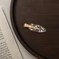 Macro detail of oval acetate hair clip with silver leaf inlay on gold metal base - Small / Transparent Silver Foil