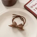 Detail of coffee-colored frosted bow hair tie with durable double-strand elastic rope - Brown