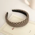 Detail of wide houndstooth headband with brown and beige knit texture and non-slip lining - Coffee Plaid