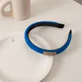 Detailed view of Klein Blue sponge headband featuring a handmade label and anti-slip teeth - Suede Handmade Label Blue
