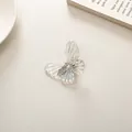 Iridescent butterfly hair clip with laser effect on a minimalist light background - Clear White