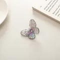 Iridescent crystal butterfly hair clip with holographic finish and wing textures - Transparent Black