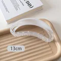 Detail view of 13cm large translucent white claw clip for thick hair on aesthetic props - Gradient White Semicircle