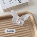 Detail view of 8.5cm frosted white butterfly hair claw clip with golden metal spring - Gradient White Butterfly