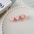 Détail d'une pince à cheveux cœur rose gelée avec texture marbrée et paillettes - Coeur à Paillettes Double Couche (8)