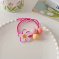 Detail of sweet floral hair tie with colorful matte beads and acrylic flower on a tray - Rose Pink Flower