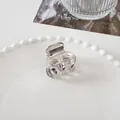Detailed close-up of a mini silver metal hair claw clip on a decorative tray - 3.5cm / Medium Eight-Claw - Silver