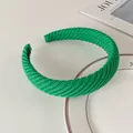 Detailed view of the bright green knitted headband with diagonal textured weaving fabric - 10# Green