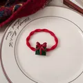 Detail of red elastic hair tie with green Christmas gift box charm on a white ceramic plate - 4# Red Tie - Red Bow Box