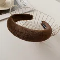 Detail of a thick dark brown faux rabbit fur headband with a handmade inner woven label - Dark Coffee