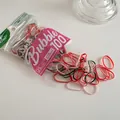 Macro shot of colorful high-elastic hair bands in red, pink, and dark green 100pcs pack - Dark Green and Red