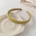 Detail of olive green padded leather headband with non-slip lining on ceramic plate - Fruit Green