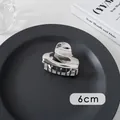 Detailed view of a 6cm silver heart-shaped metal hair claw clip on a black tray - Small Round/Heart (20#)