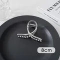 Silver large metal hair claw clip with 8cm measurement on a minimalist dark tray - Small Cross (18#)