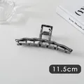 Detailed view of the 11.5cm large irregular wavy metal hair claw clip in dark grey - Bar Wave (25#)