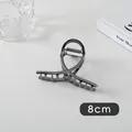 Detail of 8cm gunmetal grey hair claw clip showing metallic cross curve design - Small Cross (19#)