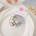 Detail of macaron color hair ties with bear charms in elegant lifestyle setting - Bear Hair Tie