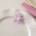 Detailed view of a purple cartoon bear hair clip with a heart on a decorative tray - Light Purple - Duckbill Clip