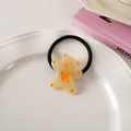 Cute cartoon bear hair tie with orange heart detail on a white ceramic display tray - Jelly Yellow - Hair Tie