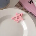 Pink star hair clip with hollow-out design on a white ceramic plate for summer hair styling - Light Pink Star