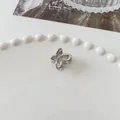Mini silver butterfly hair claw clip with hollow metal design on white lace plate - Mini Butterfly - Silver