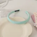 Detailed fabric texture of mint green handmade headband with fine white weaving - Green