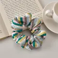 Detailed view of colorful striped scrunchie texture with knitted fabric on a book - Green Pink Striped - Regular