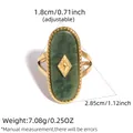 Adjustable gold ring featuring a large oval dark green stone with beaded edge detail - Adjustable / Dark Green