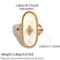 Adjustable golden stainless steel oval shell ring with geometric stud detail - Adjustable / White (Mother of Pearl Texture)