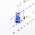 Detailed close-up of a 2cm blue tassel pendant with gold hanging ring for DIY jewelry making - Sapphire Blue