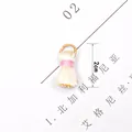 Macro shot of 2cm cream tassel pendant with pink thread and gold ring for DIY jewelry - Off White