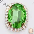 Macro detail of oval green gemstone with white rhinestone border in rose gold setting - 12*14mm (Main Gem 8*10mm) / Gold Base Grass Green