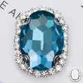 Pierre ovale en verre bleu avec halo de strass et griffe en cuivre à coudre - Base Argentée Bleu Lac