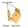 Detail view of golden flower ring showing a width of 1.25cm and weight of 1.8g - Single Ear Cuff - Gold