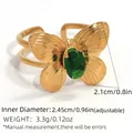 Adjustable gold butterfly ring featuring green zircon stone with 2.1cm wing detail - Green