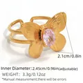 Adjustable golden ring featuring butterfly design with pink-purple gemstone and double band - Pink Purple
