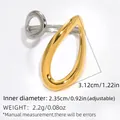 Modern two-tone crossover open ring featuring gold teardrop and silver oval loops - Gold and Silver Two-tone
