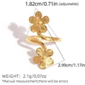 Minimalist golden floral wrap open ring with double five-petal flowers in a spiral design - Gold