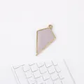 Detailed view of lavender geometric metal pendants with gold frames for DIY jewelry crafting - Purple