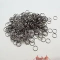 Macro view of gunmetal open jump rings for DIY jewelry making and metal crafts - Gun Black